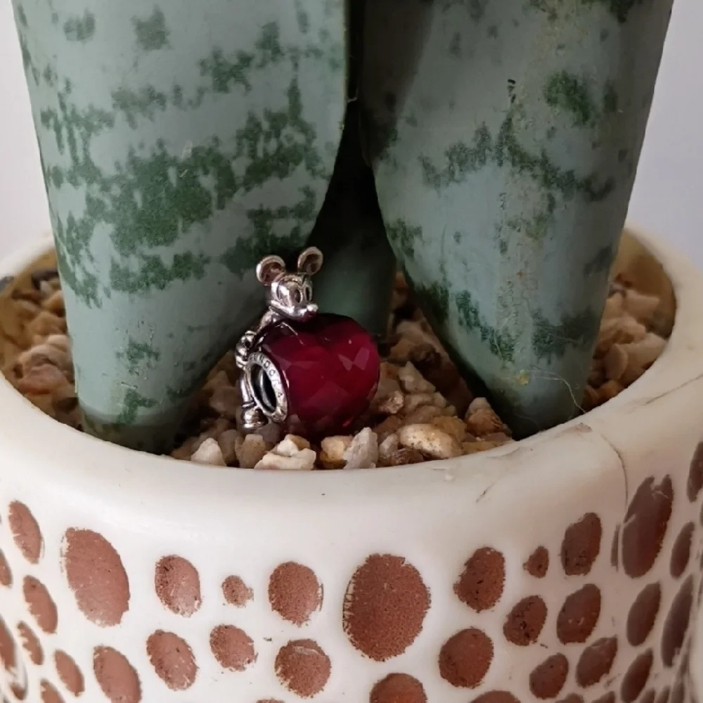 Pandora Disney Mickey Mouse Heart charm featuring a fuchsia crystal.
